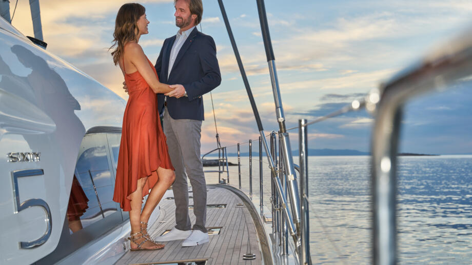 Worry-free Yacht Charter Management Program - owner couple enjoying the sunset aboard their yacht