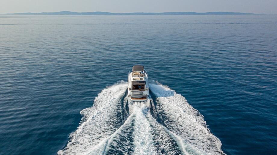 Motorboat cruising aerial view - Nava Boats Charter